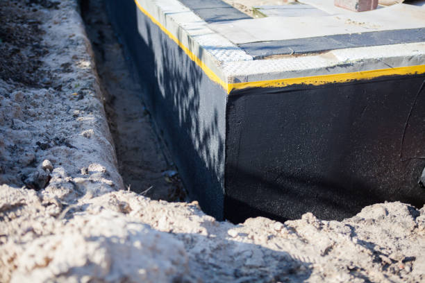 Professional Waterproofing technician working in Anniston, AL